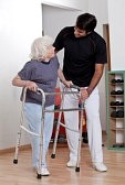 14350977-a-therapist-assisting-a-senior-woman-onto-her-walker
